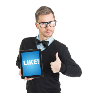 Elegant businessman holding digital tablet that states like